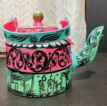Tribal art kettle with pattachitra boarders